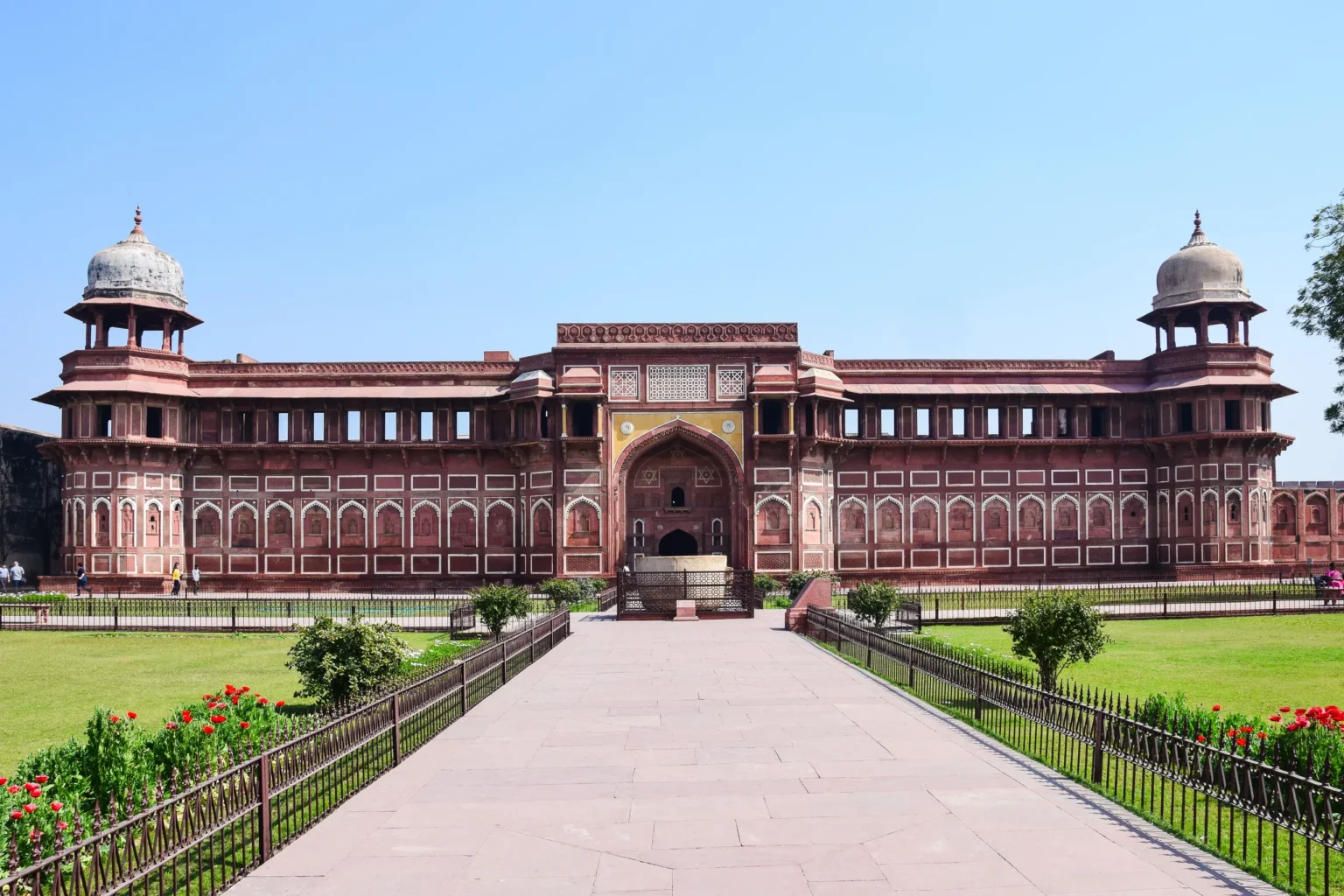 Jahangiri Mahal inside Agra Fort beyond a garden path