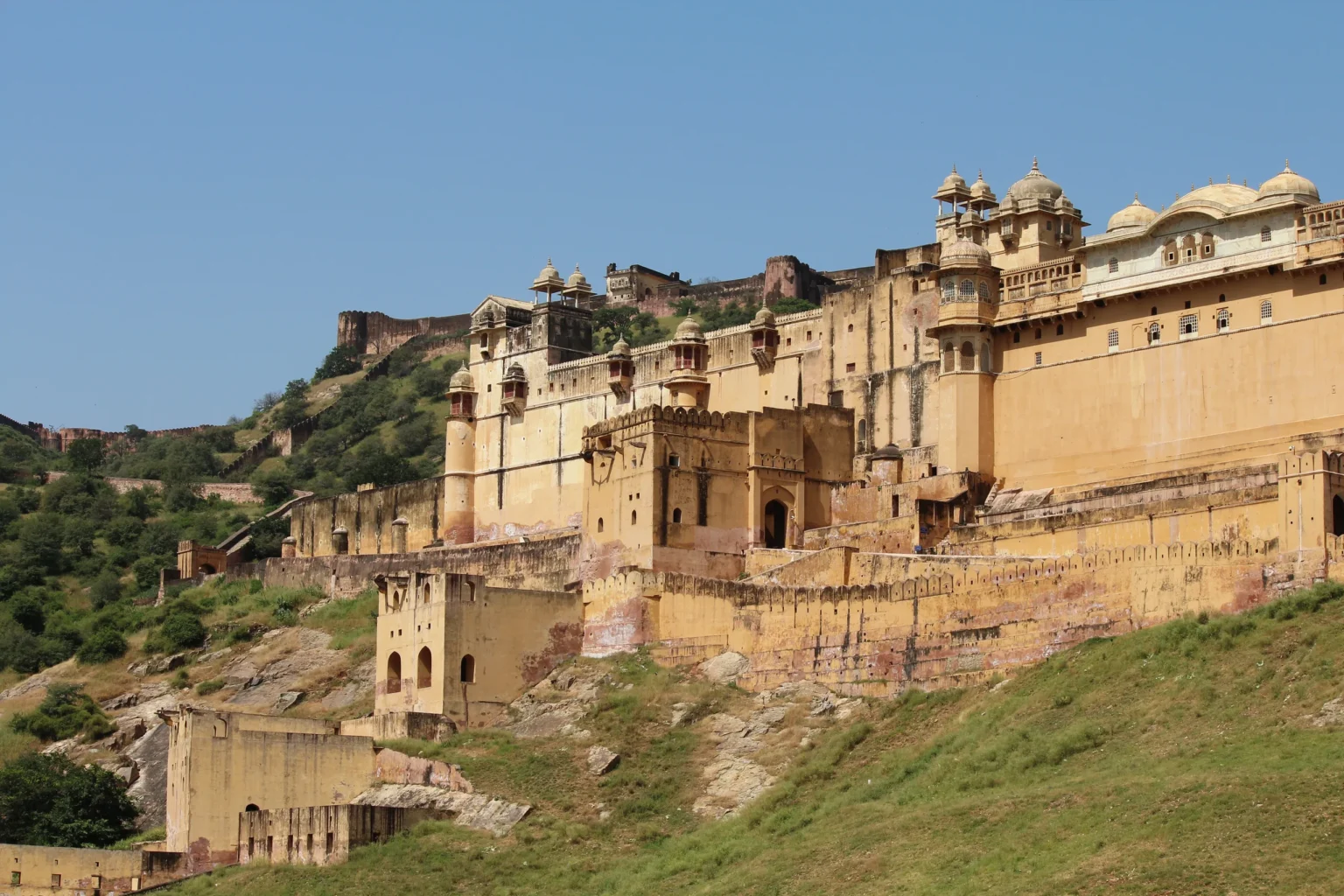 Amber Fort ramparts and palaces climbing the hillside above Amer