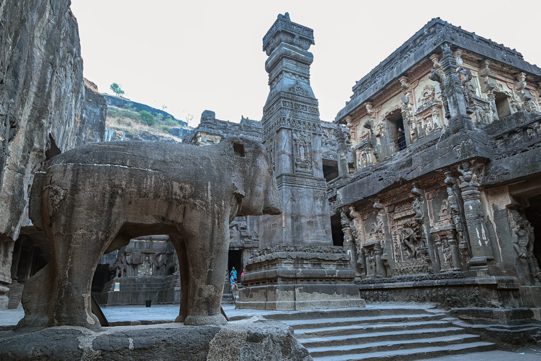 Stone elephant and pillar in the courtyard of the Kailasa Temple, Ellora