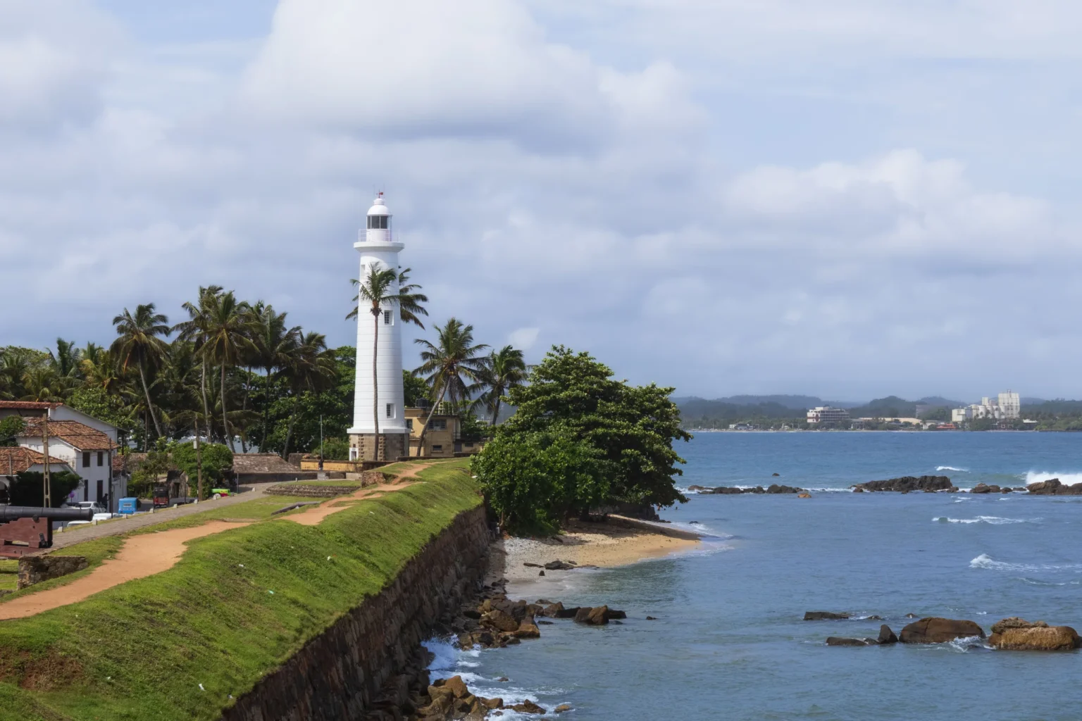 Galle lighthouse above the fort ramparts and the Indian Ocean