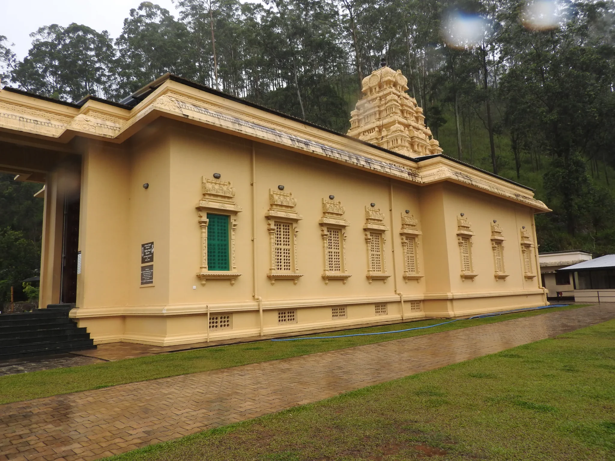 Yellow walls and tower of the Sri Bhakta Hanuman Temple, Ramboda