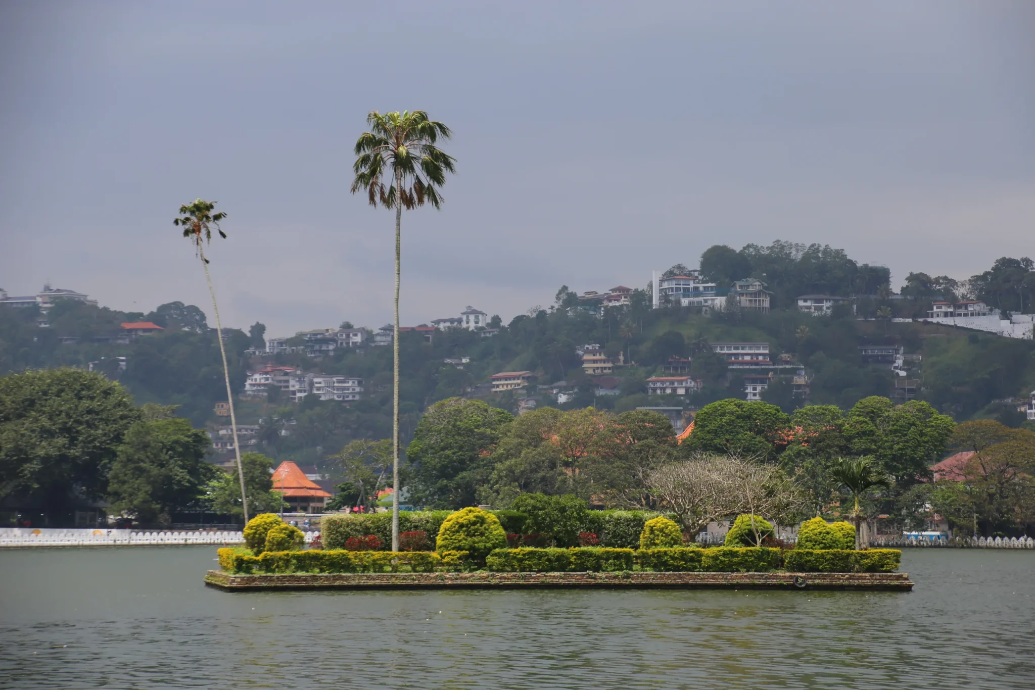 Diyathilaka Mandapa island on Kandy Lake with the town behind