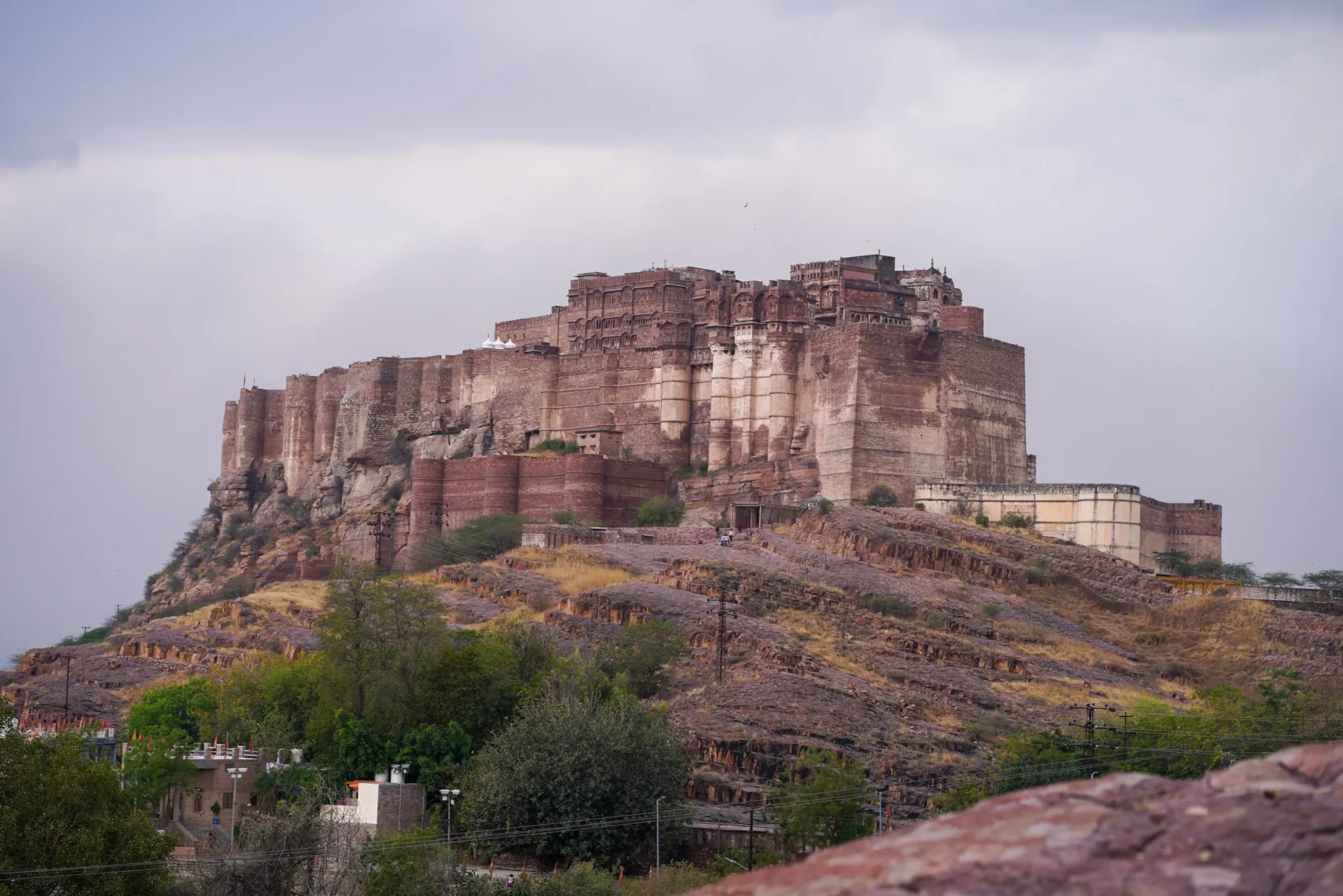 Mehrangarh Fort on its rocky outcrop above Jodhpur under a stormy sky