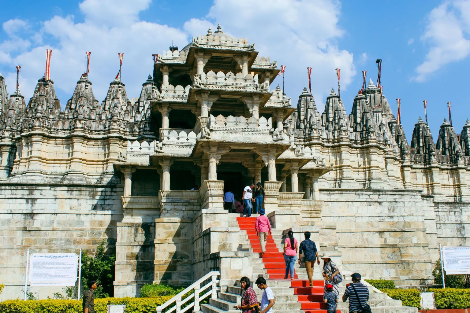 Ranakpur Jain Temple entrance with spires and red-carpeted steps