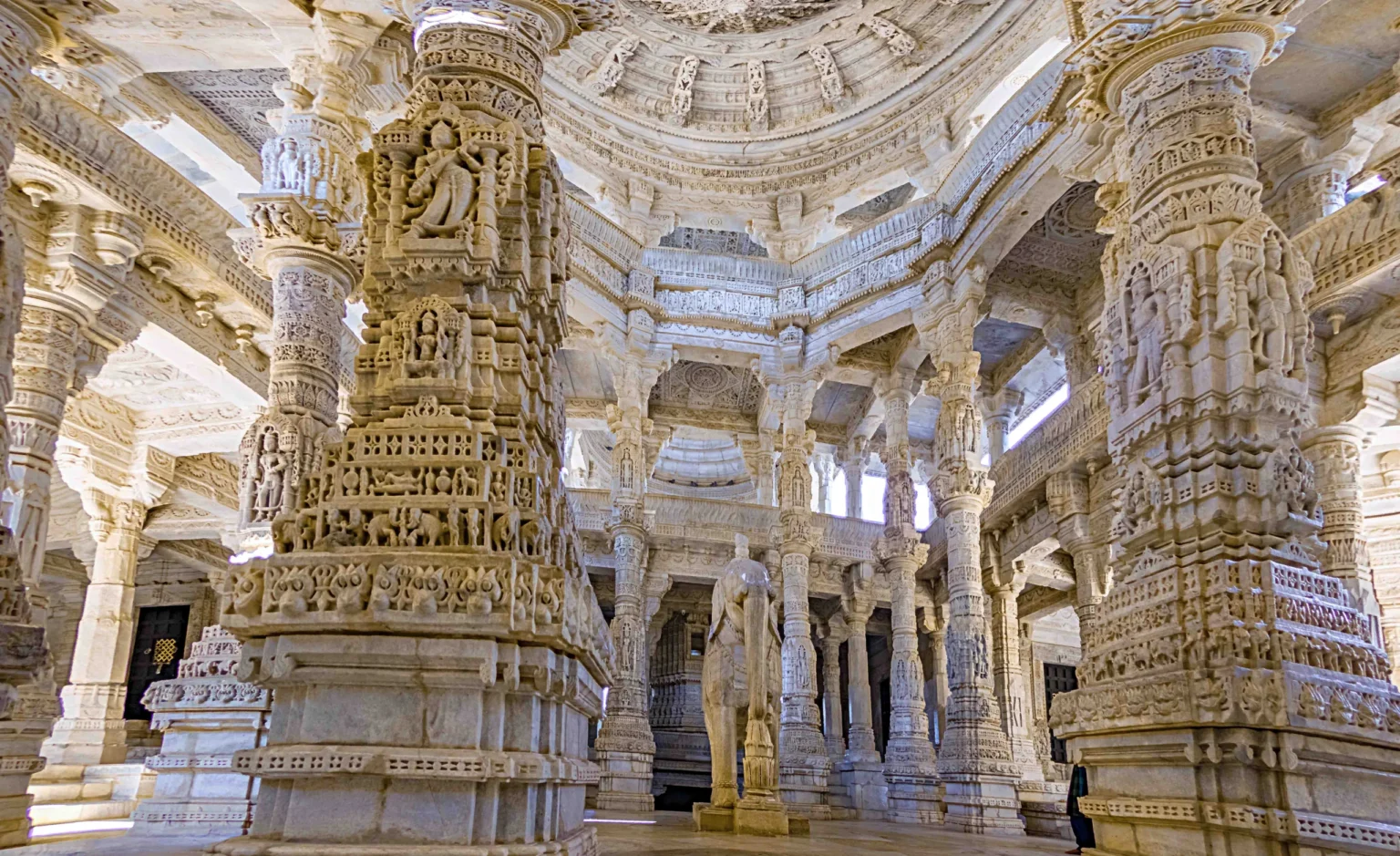 Intricately carved marble pillars inside the Ranakpur Jain Temple