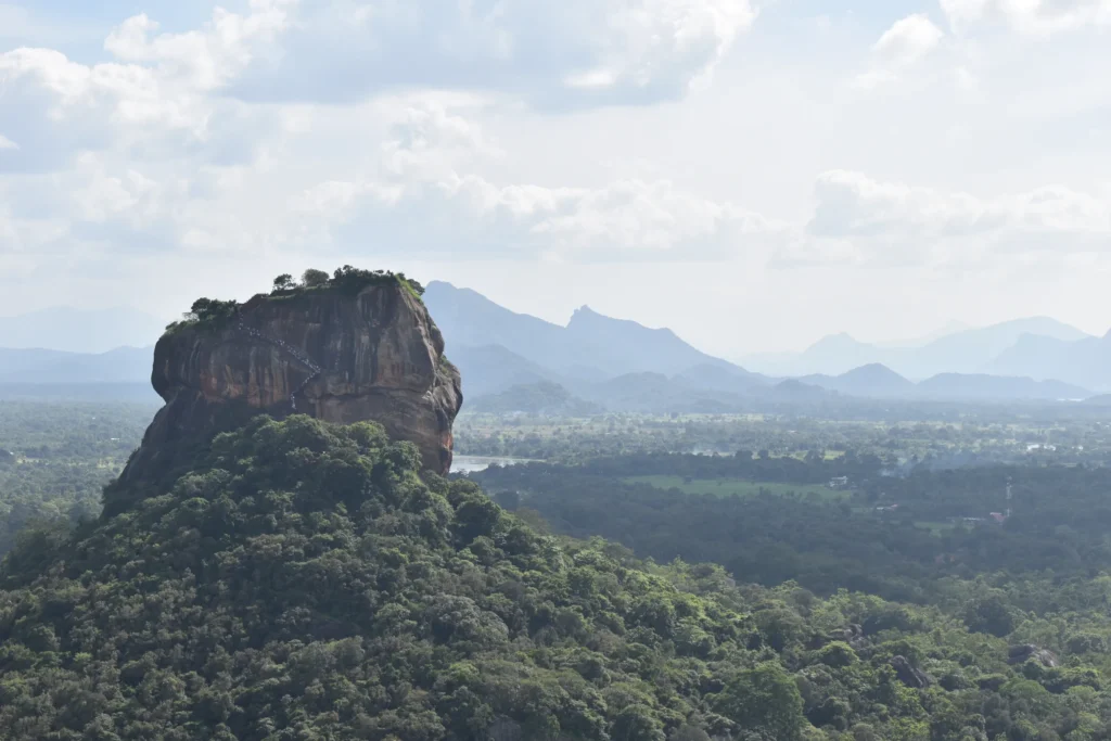 Sigiriya Rock Fortress seen from Pidurangala Rock, mountains beyond