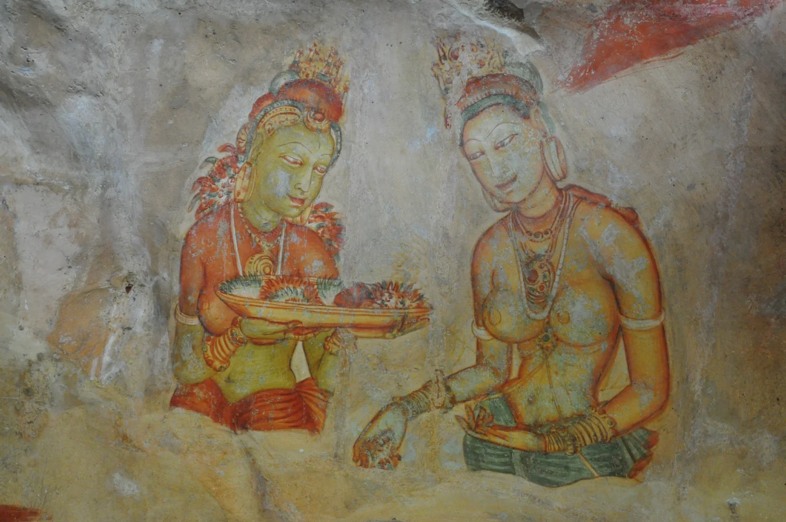 Fifth-century Sigiriya frescoes of two maidens painted on the rock