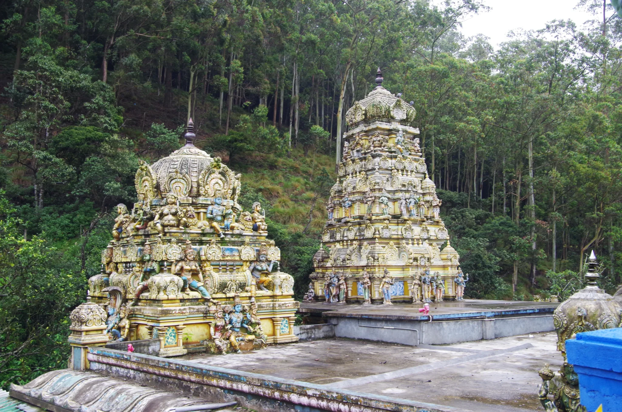 Twin painted towers of the Seetha Amman Temple amid highland forest
