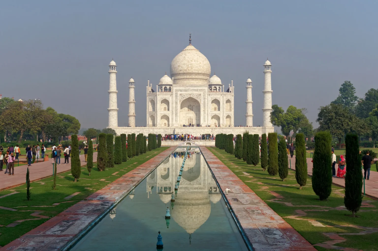 Taj Mahal beyond the garden water channel in morning light