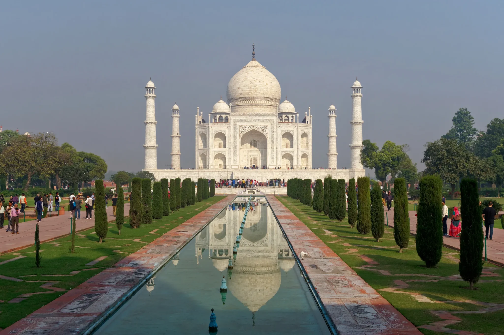 Taj Mahal beyond the garden water channel in morning light