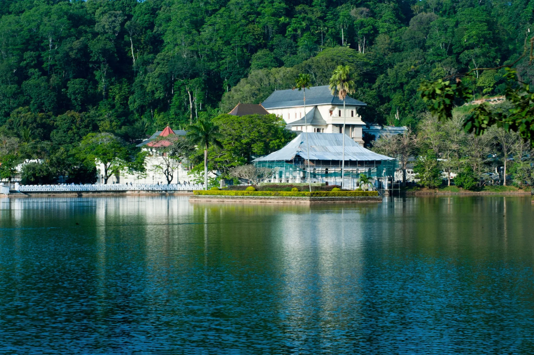 Temple of the Tooth and its pavilion across Kandy Lake